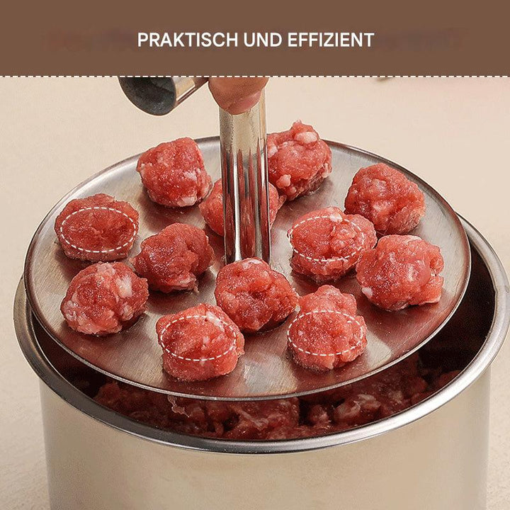 Rozsdamentes acél húsgombóc-formázó részlet, a kézzel lenyomott koronggal az edény fölött.
