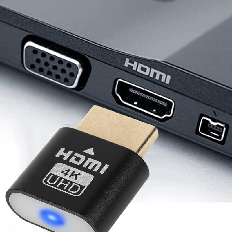 A fekete eszköz közelről, egy laptop HDMI-portja elé tartva, mellette VGA és más csatlakozók láthatók. 3