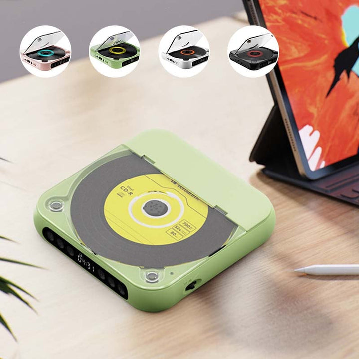 Zöld lejátszó sárga lemezzel egy asztalon tablet mellett, a felső sorban a négy elérhető szín kis képei. 6