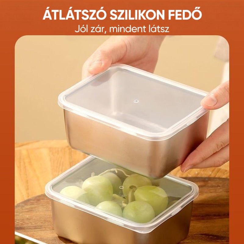 Közelkép az átlátszó fedélről, amelyet egy kéz a szőlővel teli acél dobozra helyez. 9
