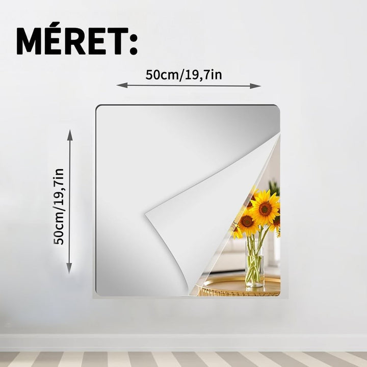 Négyzet alakú, 50×50 centis tükörlap a falon, méretjelölő nyilakkal, felhajlított sarka mögött napraforgós váza látszik. 11