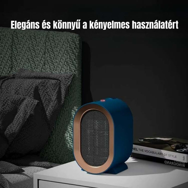 Kék kerámiafűtő egy fehér éjjeliszekrényen sötét hálószobában, piros működésjelző fénnyel 2