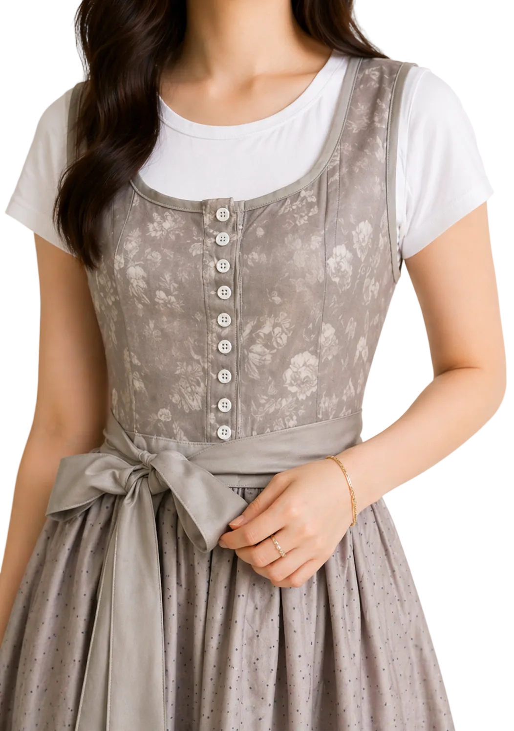 Szürke, virágmintás dirndl ruha közelképe, gombos fűzőrésszel és oldalsó masnis övvel.