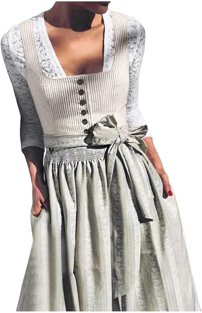 A női dirndl részlete csipkés blúzzal, gombos előlappal és redőzött szoknyarésszel.