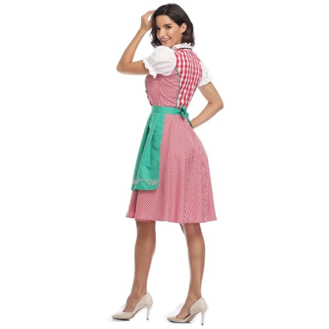 Piros kockás dirndl zöld köténnyel, hátulnézetben.