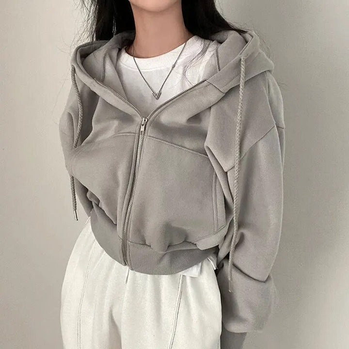 Női rövid szabású mellény kapucnival és oversized szabással – Rinette